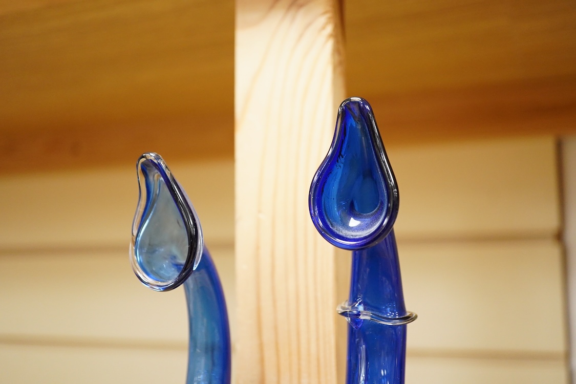 Two Persian blue glass tear catchers, largest 24cm high